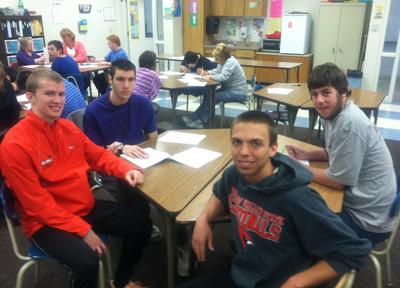 Drew Meylan and Patrick Frank with two students from the Bay-Arenac ISD Living and Learning Center.