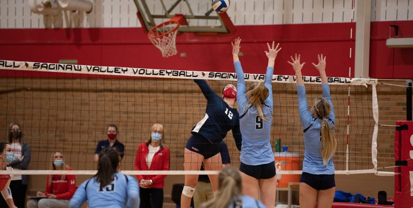 Cardinal Volleyball holds on to top Eagles in four